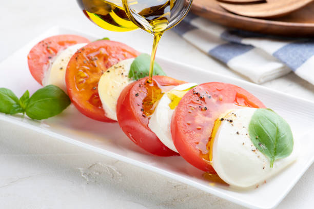 Fresh Caprese Salad with Tomatoes and Mozzarella and Basil Olive Oil